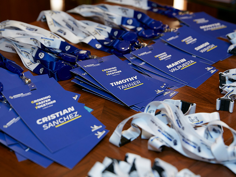 Personalized lanyards with cards for an event. 